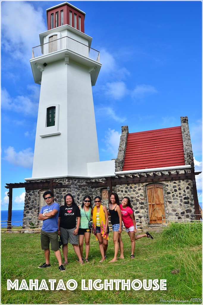 pose with the lighthouse